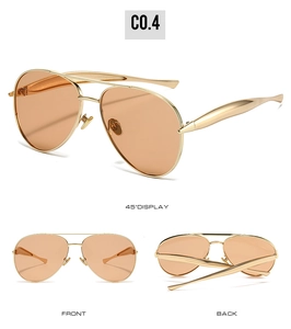 Detailed views of vintage aviator sunglasses with gold metal frame and orange lenses