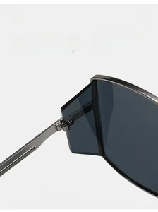 Detail of durable silver metal hinge on vintage small round frame sunglasses