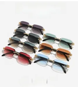Close-up of rimless gradient sunglasses featuring luxury diamond-encrusted metal hinges