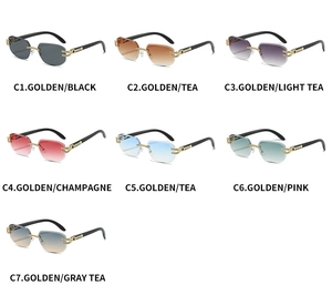 Detail view of seven rimless square sunglasses with rhinestone accents and gold metal temples