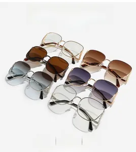Detailed view of square sunglasses with rhinestone-encrusted curved metal temples