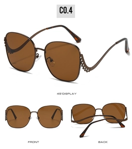 Detail view of crystal-encrusted brown sunglasses with tortoise temple tips and side hollows