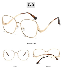 Detailed view of oversized metal sunglasses with side pearl and rhinestone embellishments