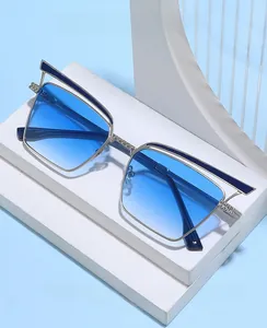 Detail of silver metal bridge and blue gradient lenses on retro cat-eye sunglasses