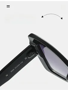 Detailed close-up of the durable hinge and frame specs on black oversized sunglasses