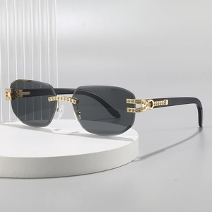Luxurious rimless square sunglasses with grey lenses and gold rhinestone metal hinges