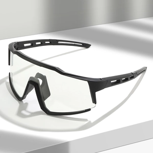 Sport cycling goggles with black matte frames and large clear lens on minimalist pedestal