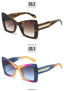 Detailed 45-degree view of oversized butterfly sunglasses in tortoiseshell and gradient colors