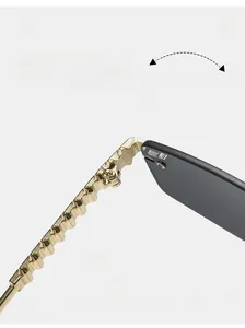 Macro detail of golden wave-shaped metal hinges on rimless fashion sunglasses