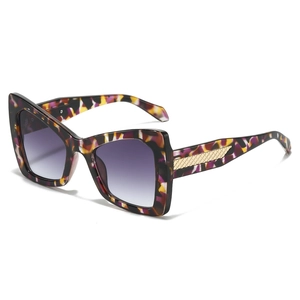 Classic large frame cateye sunglasses with colorful tortoiseshell pattern and gold accents