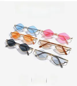 Flat lay of half-rim geometric diamond sunglasses in six vibrant lens colors with gold frames