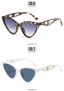 Detail of butterfly frame sunglasses with metal hollow temples and pearl embellishments