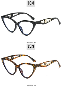 Cat eye sunglasses featuring cut-out temples and pearl accents in black and tortoiseshell