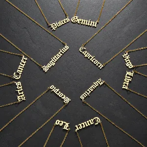 Detailed top view of 12 zodiac constellation necklaces in gold gothic lettering style