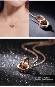 Detail of rose gold titanium necklace with Roman numeral rings and cubic zirconia