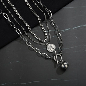 Multi-layer silver chain necklace with coin pendant and OT buckle in minimalist hip-hop style