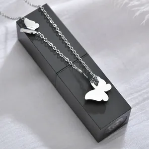 Detailed view of silver stainless steel butterfly pendant necklace with side accent