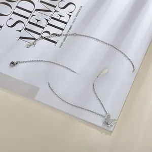 Detailed view of the silver butterfly pendant necklace featuring sparkling zircon accents
