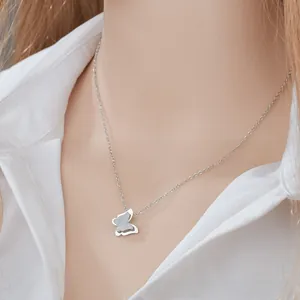 Detailed view of double butterfly pendant with matte and polished silver finishes