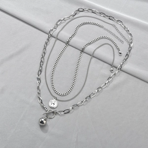Three-layer silver stacking necklace with coin pendant and metal ball OT buckle design