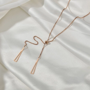 Rose gold Y-shaped titanium necklace with adjustable slider and hollow triangle pendants