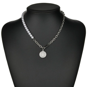 Retro asymmetric pearl and silver metal chain necklace with St. Benedict medal pendant