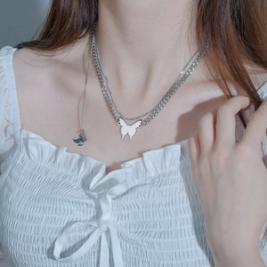 Close-up of double-layer stainless steel butterfly choker necklace on neck