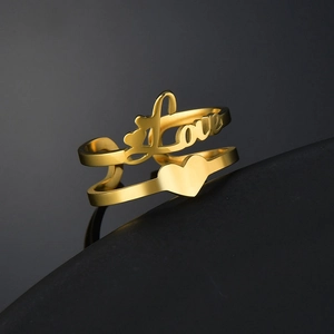 Detailed view of a gold double-layer open ring featuring Love script and heart shape
