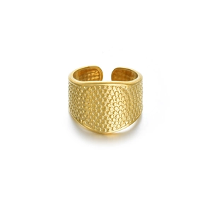 Detailed view of adjustable golden wide ring with textured micro-bead relief pattern