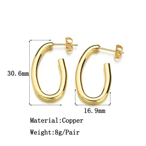 Polished gold hollow oval hoop earrings for women made of copper 30.6mm by 16.9mm