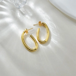 Minimalist golden hollow oval hoop earrings for women with a high-polished metallic finish
