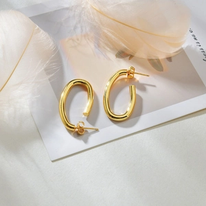 Minimalist golden oval hollow hoop earrings with a high-polished metallic finish