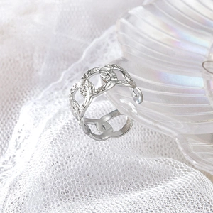 Detailed view of silver hollow chain ring with adjustable open design and mesh texture