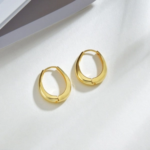 Minimalist oval U-shaped golden earrings with polished glossy metal finish and sleek design
