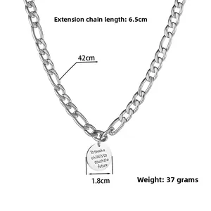 Detail view of silver Figaro chain necklace showing 42cm length and round charm size