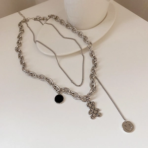 Double-layered titanium steel necklace with teddy bear, smiley face, and black round charms