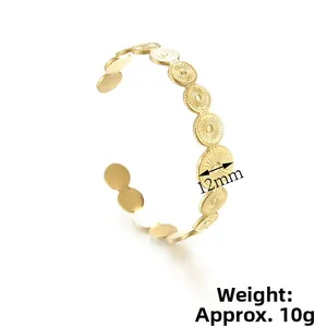 Dettaglio dei dischi placcati oro 14K e dei motivi a raggiera incisi da 12mm