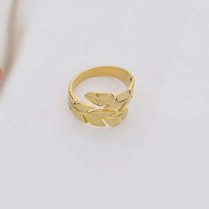 Minimalist gold leaf wrap ring in stainless steel with detailed feather texture