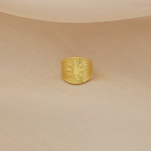 Golden brushed wide open ring featuring embossed starburst and bead-trimmed edges