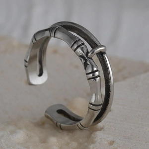 Detail of vintage bamboo texture open ring crafted from retro titanium steel