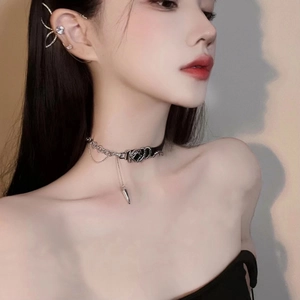 Silver chain choker with black leather, cone pendant and sparkling ear cuff on model