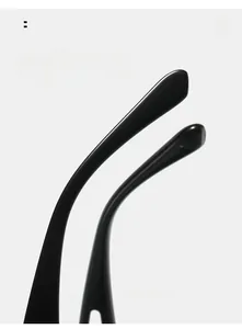Detail view of curved black sunglass legs for comfort by XY GLASSES on white background