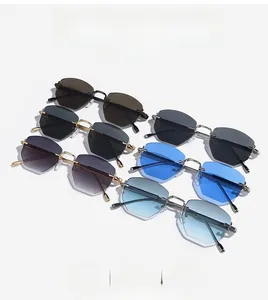 Detailed flat lay of multi-color rimless geometric sunglasses with gold metal temples