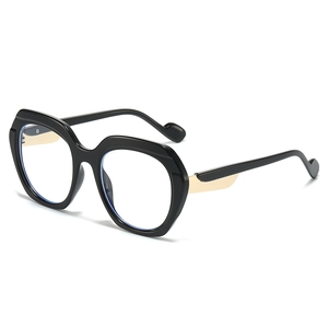 Lunettes oversize polygonales noires avec branches dorées et verres anti-lumière bleue