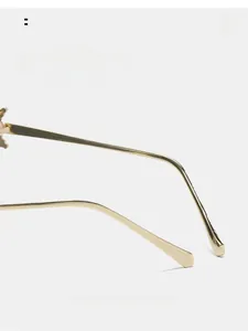 Detail of curved golden metal temples on sunglasses for a comfortable ergonomic fit