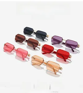 Detail view of multi-color rimless polygon sunglasses with elegant gold metal frames