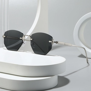 Frameless polygonal sunglasses with silver metal temples and cross decoration