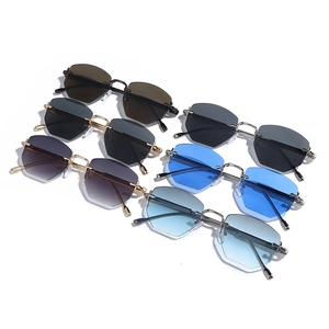 Collection of rimless polygon sunglasses with metal frames in various gradient lens colors