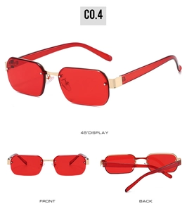 Detail view of rimless polygon sunglasses featuring red tinted lenses and gold hardware
