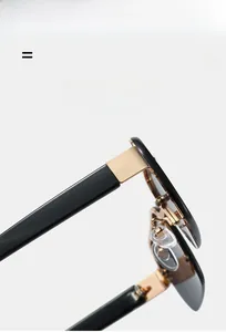 Detail showing the durable gold metal hinges and black frame of flexible sunglasses